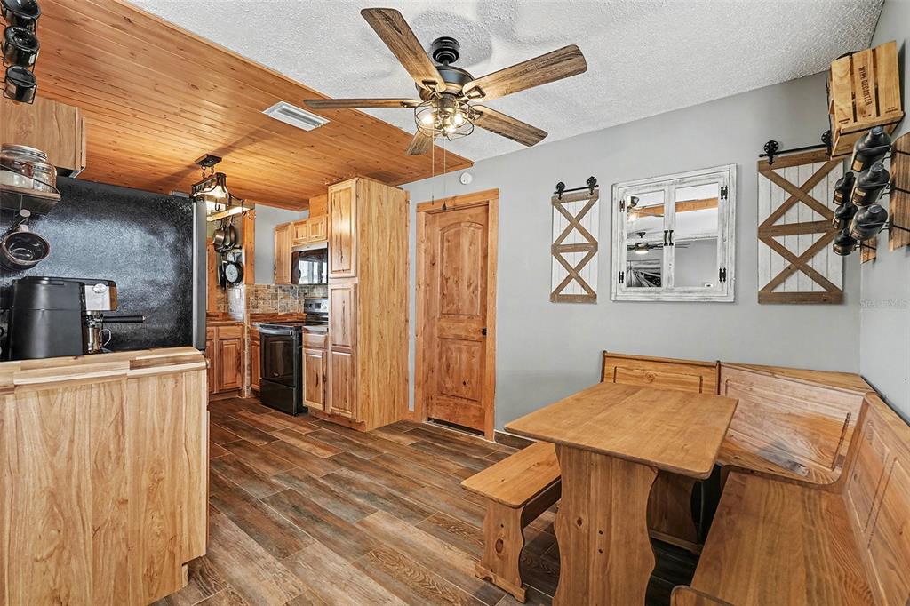 557 Flame Tree Drive Apollo Beach, FL 33572 - Photo 9 of 31 a bedroom with a bed and a chandelier