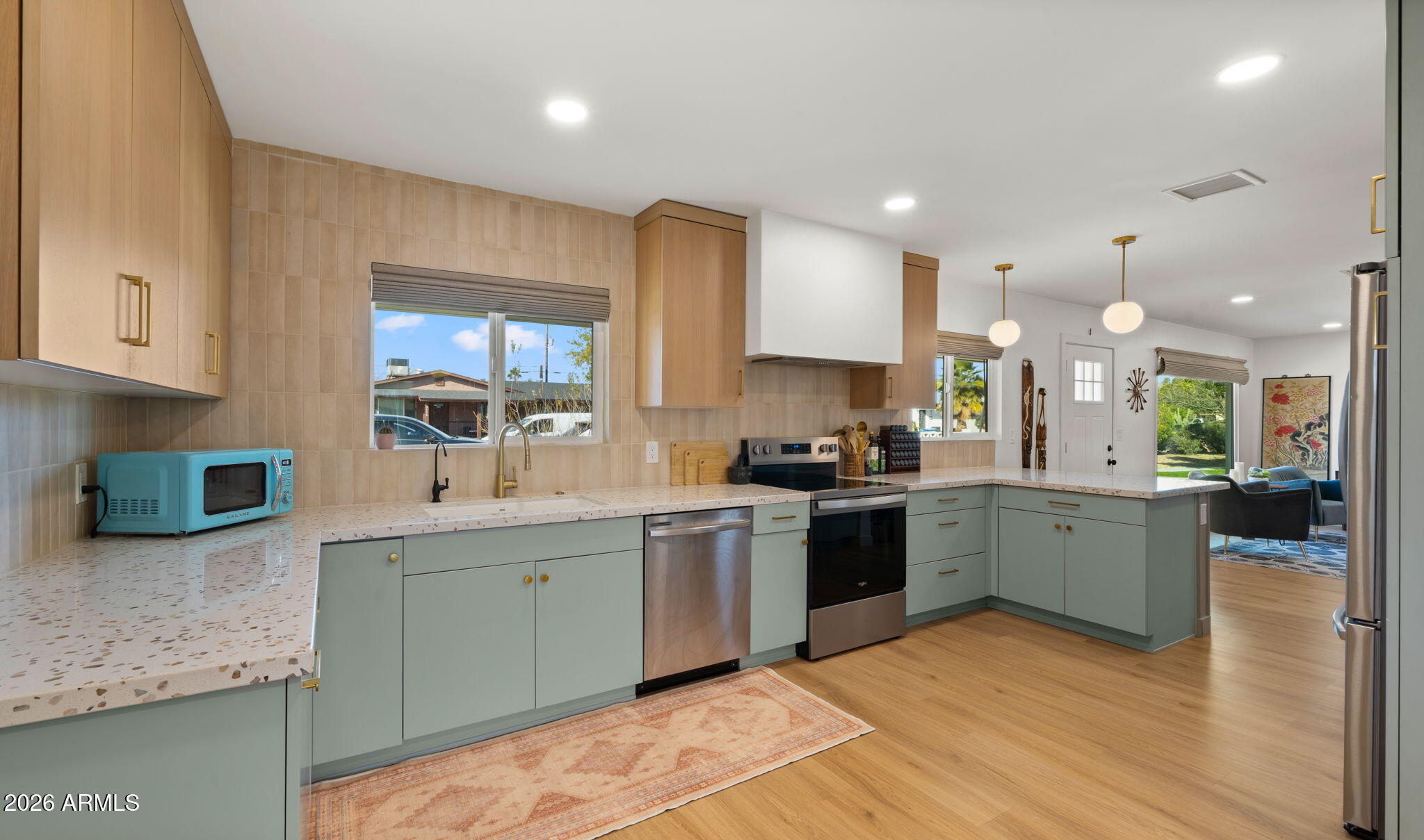 2115 North Normal Avenue Tempe, AZ 85288 - Photo 5 of 38 a kitchen with a sink cabinets and wooden floor