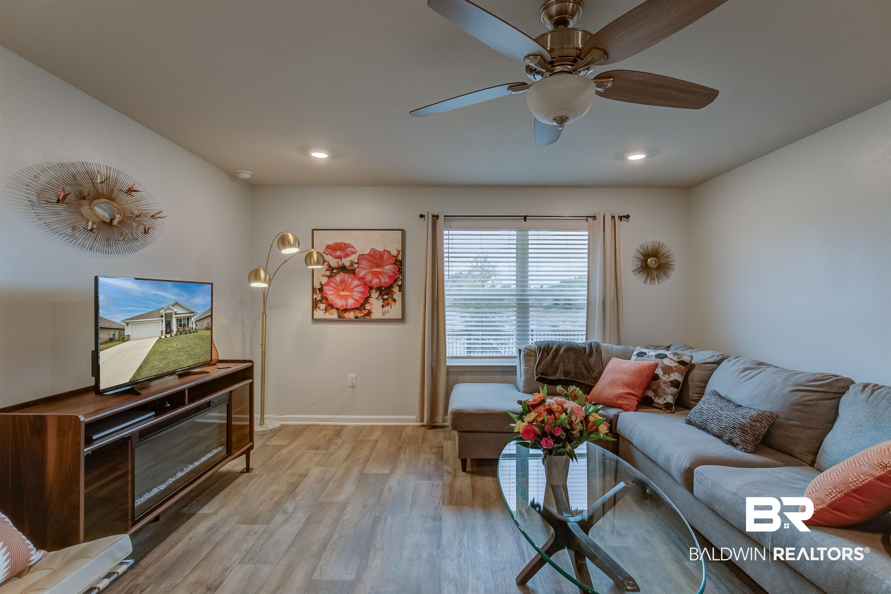 8033 Irwin Loop Daphne, AL 36526 - Photo 12 of 38 Living area featuring wood-finish flooring, recessed lighting, and a ceiling fan with light