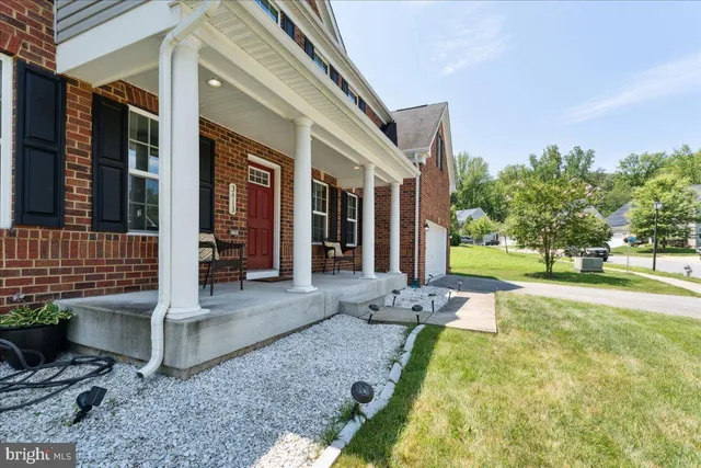 a view of a house with backyard porch and sitting area