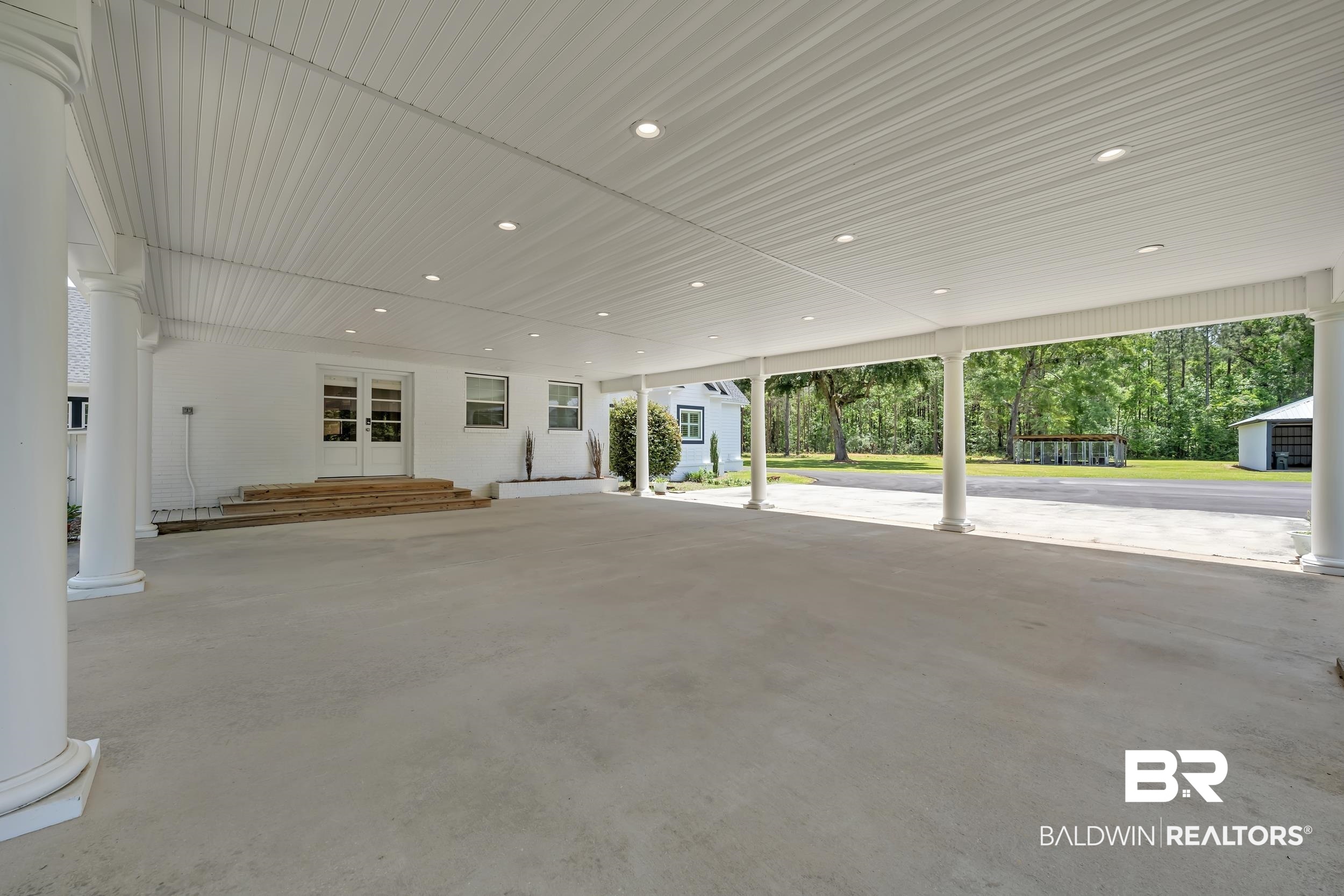 43199 Pine Grove Road Bay Minette, AL 36507 - Photo 7 of 71 Expansive covered parking area featuring multiple support columns, recessed lighting, and a beadboard ceiling
