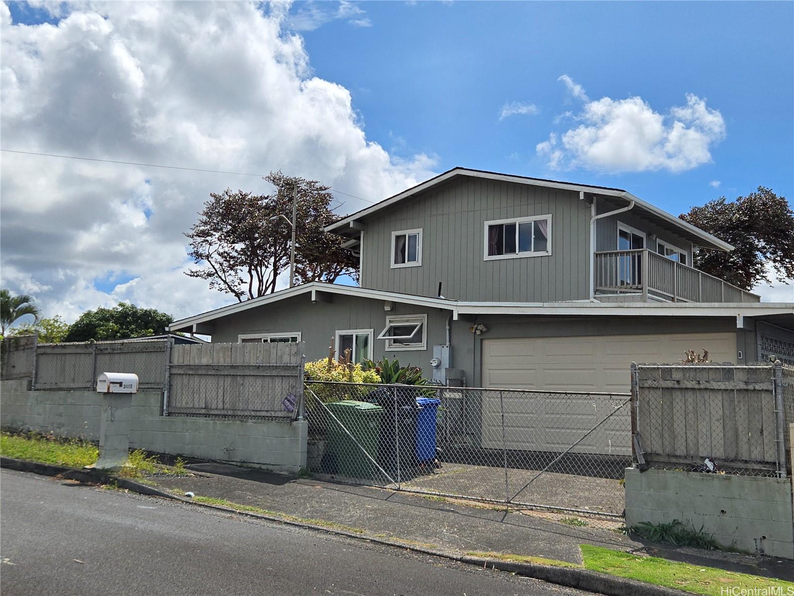 a view of a house with a garage