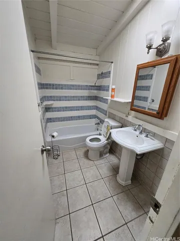 a bathroom with a bathtub and a sink