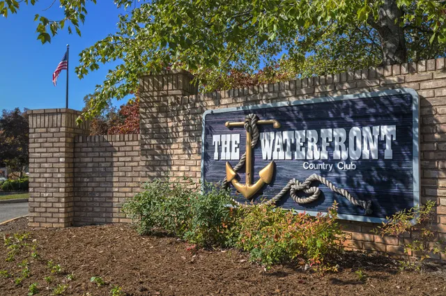 a view of a chair and table in the backyard