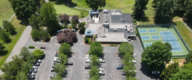 an aerial view of multiple houses with yard