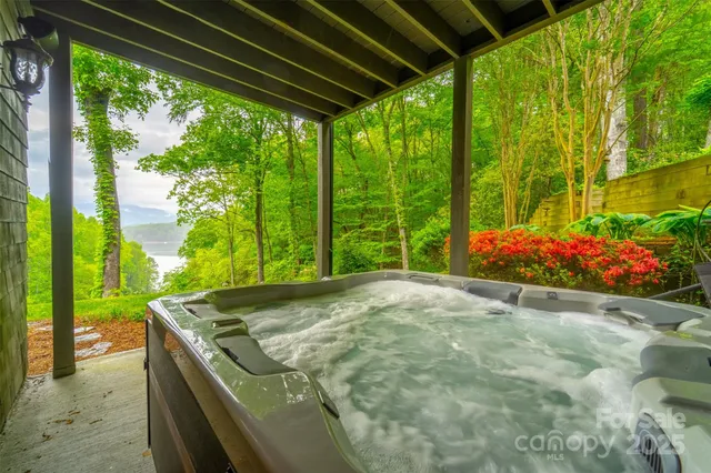 a bedroom with furniture and a large window
