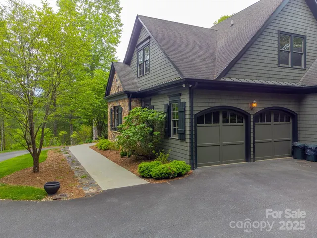 an aerial view of a house with yard and outdoor seating