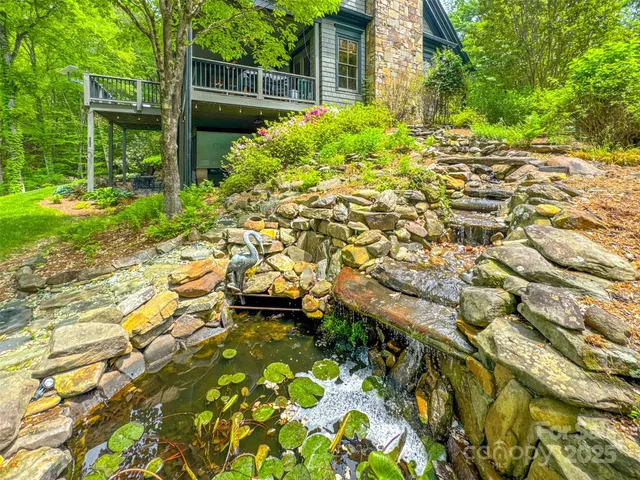 a view of house with outdoor seating area