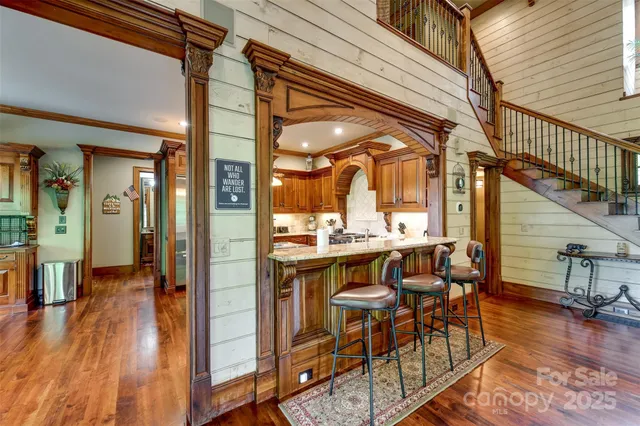 a view of a dining room with furniture wooden floor and a rug