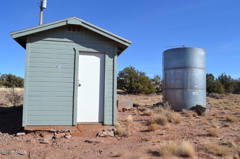8473 Navajo Lane Snowflake, AZ 85937 - Photo 9 of 11 a front view of a house with a yard