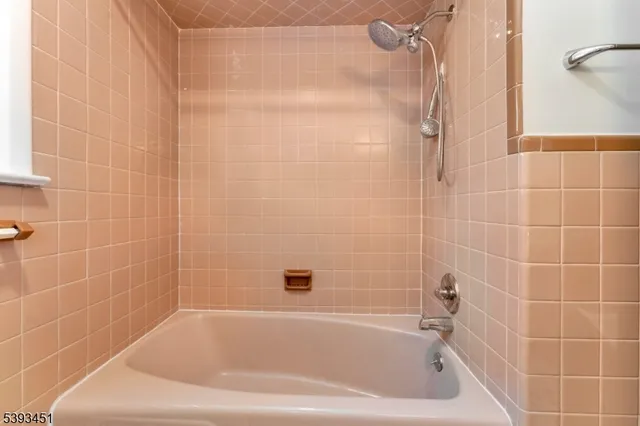 a kitchen with stainless steel appliances a refrigerator sink and cabinets