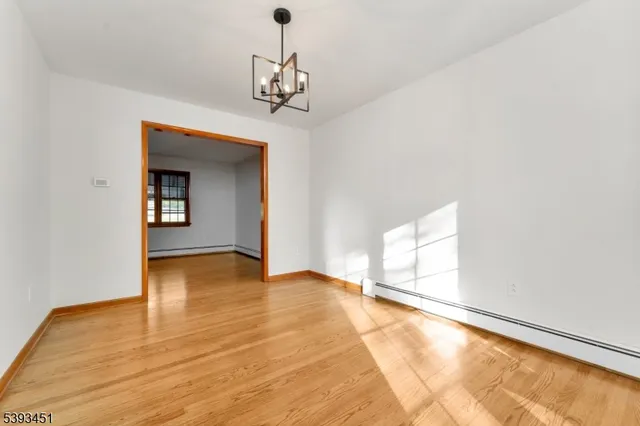 a view of an empty room with glass door