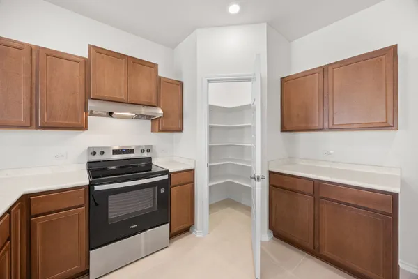 a kitchen with cabinets and appliances