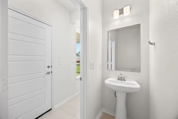 a bathroom with a sink and mirror
