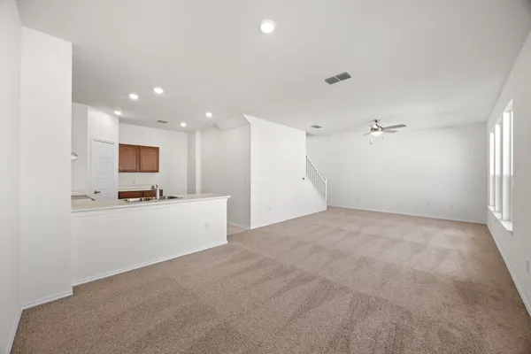 a view of a big room with kitchen and living room