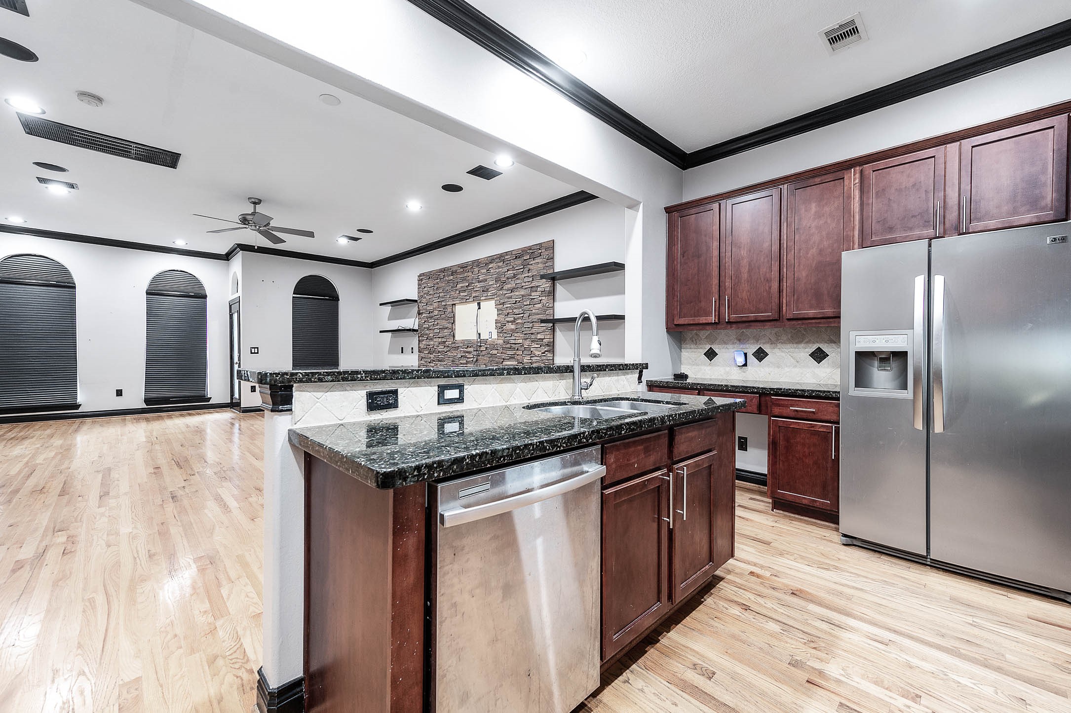 2503 Dallas Street Houston, TX 77003 - Photo 18 of 30 a kitchen with stainless steel appliances granite countertop a stove a sink dishwasher and a refrigerator