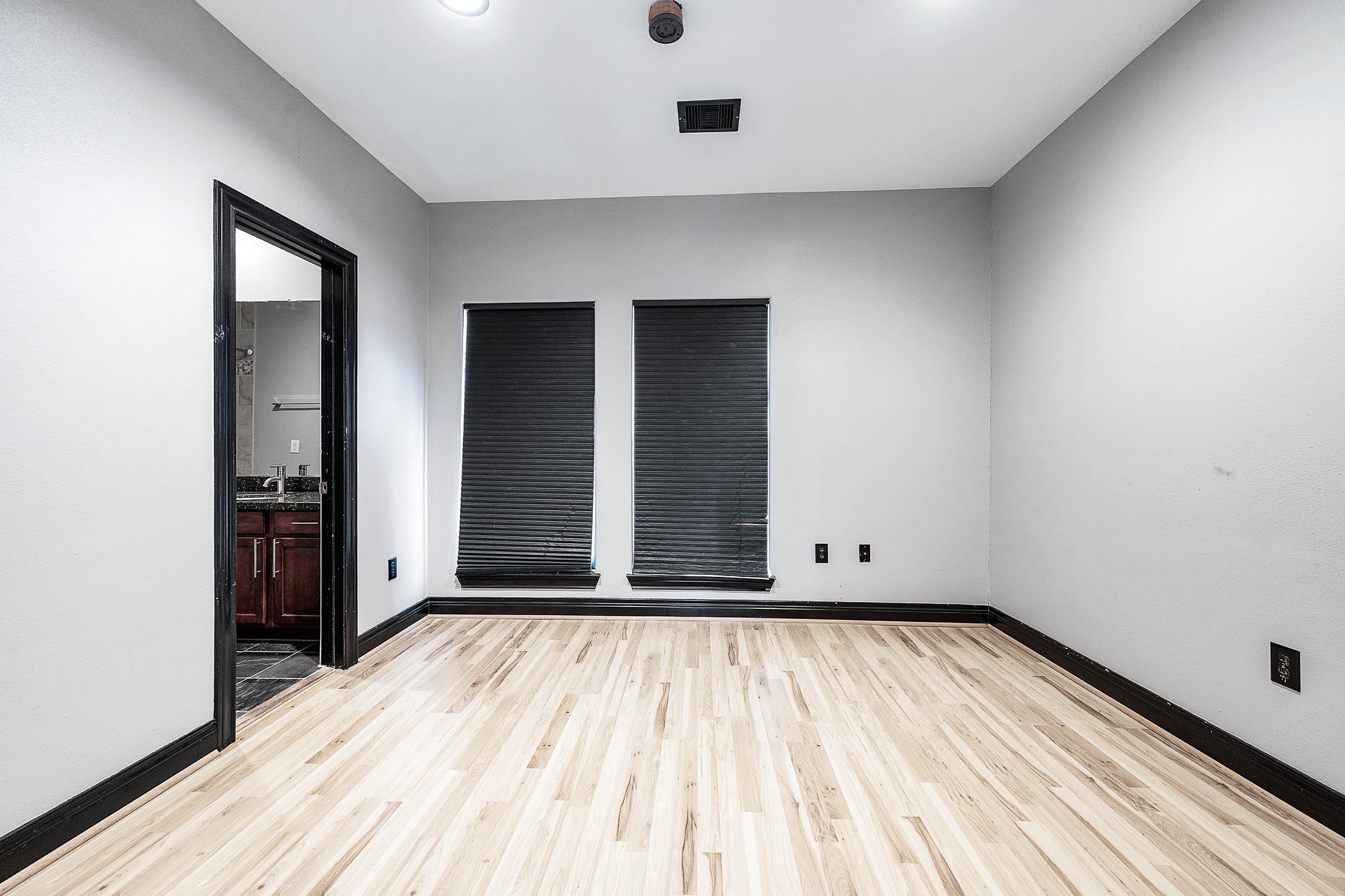 2503 Dallas Street Houston, TX 77003 - Photo 29 of 30 an empty room with wooden floor and windows