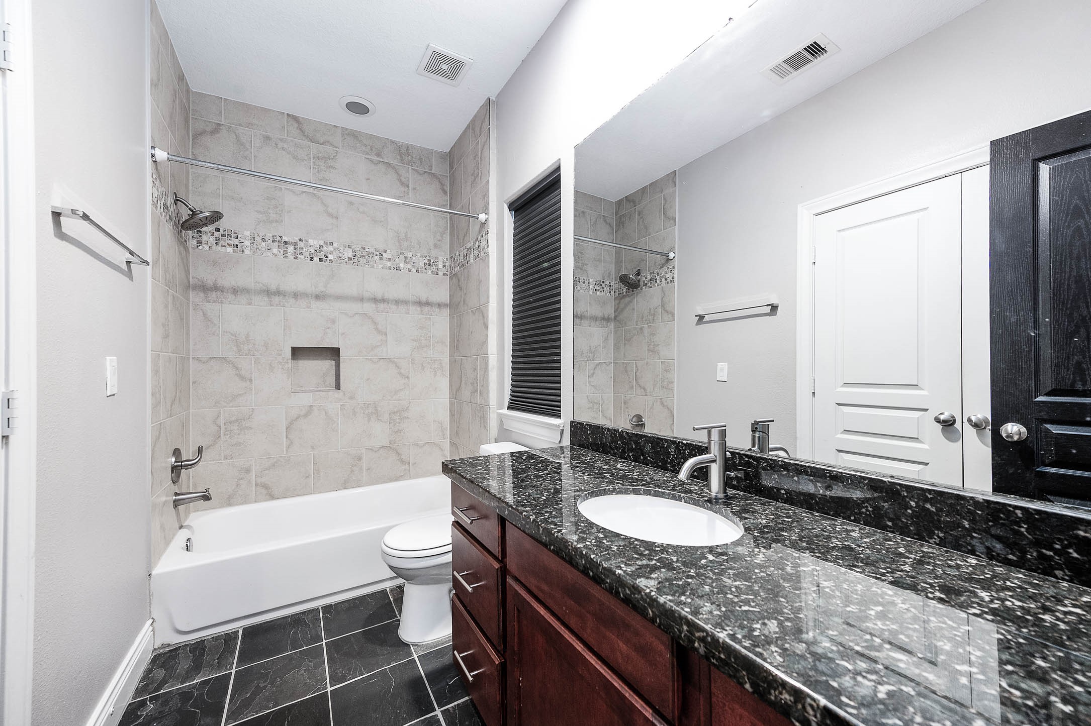 2503 Dallas Street Houston, TX 77003 - Photo 30 of 30 a bathroom with a granite countertop sink toilet and shower