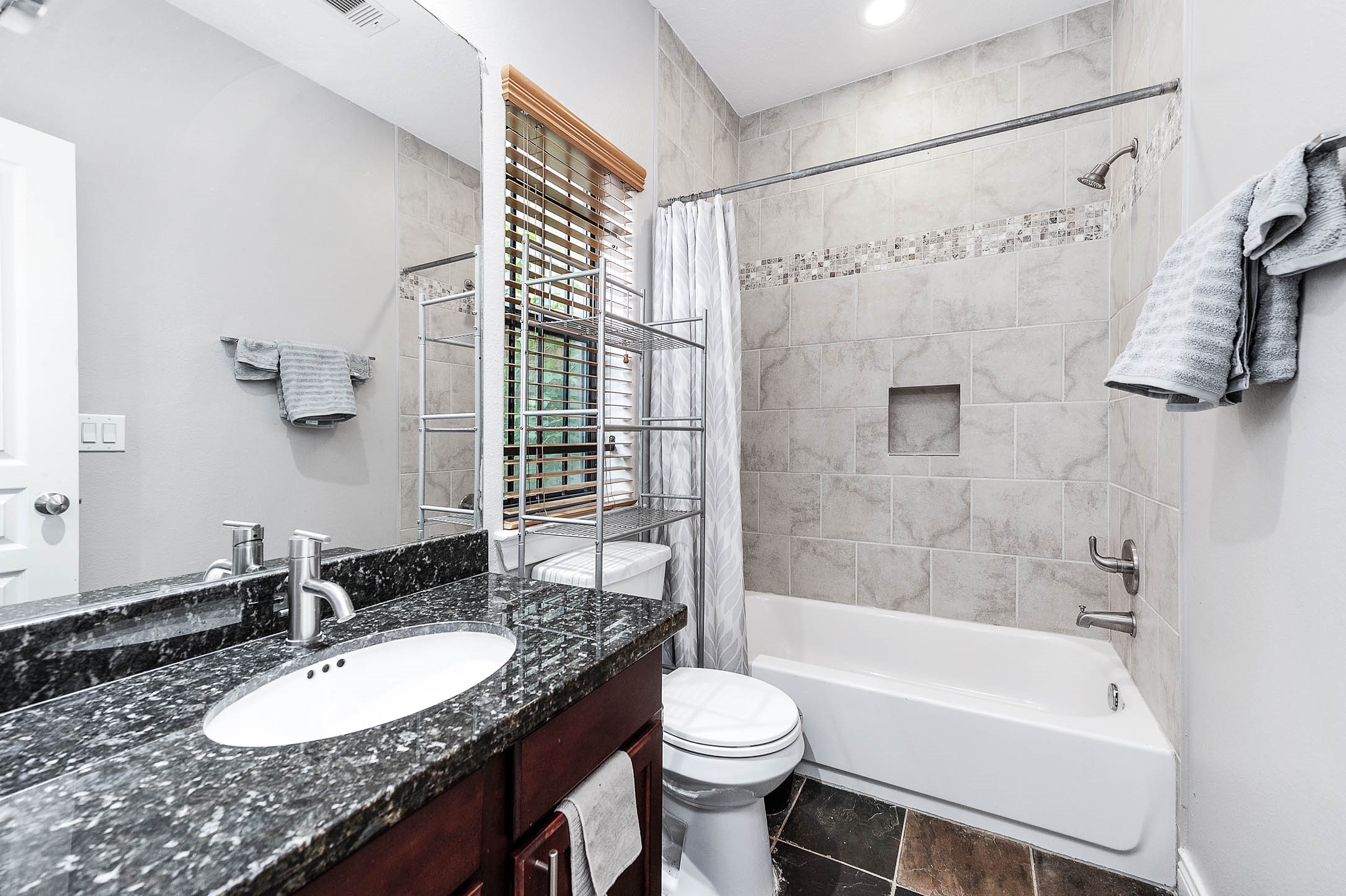 2503 Dallas Street Houston, TX 77003 - Photo 8 of 30 a bathroom with a granite countertop sink toilet and shower