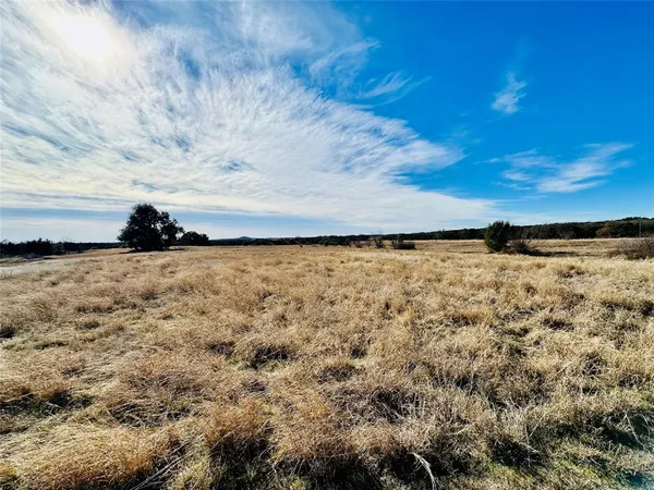 a view of a large body of water with a building in the background
