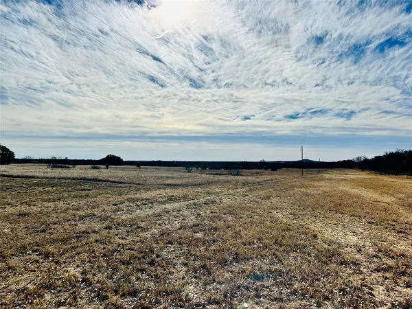 a view of a large body of water and mountain