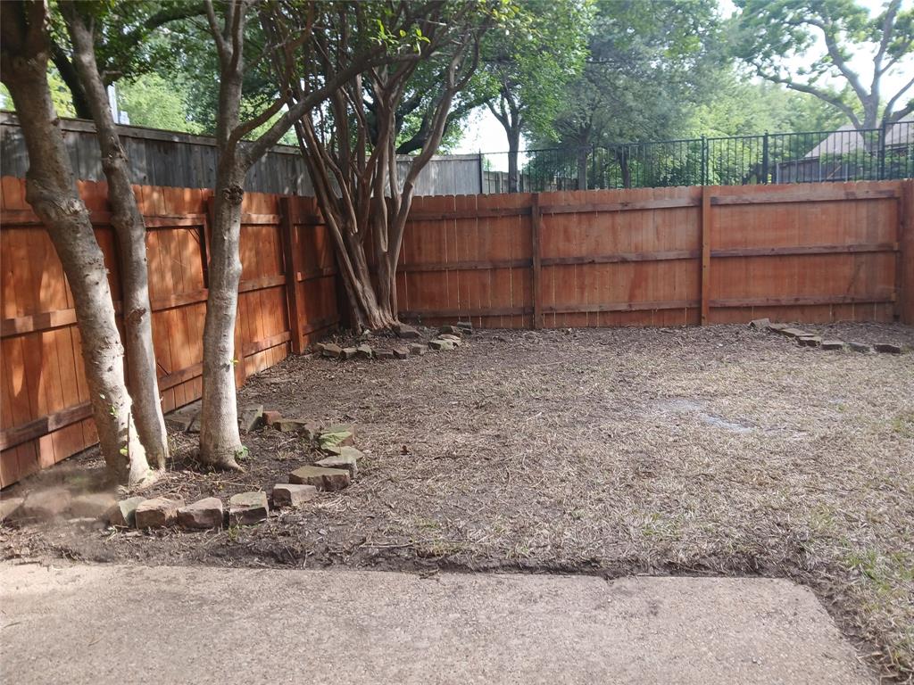 7456 East Northwest Highway, Unit H 125 Dallas, TX 75231 - Photo 2 of 10 a backyard of a house