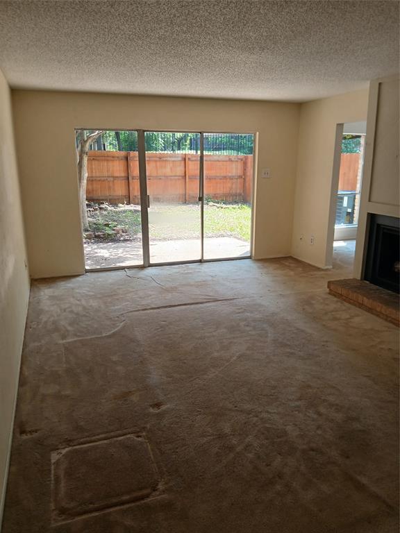 7456 East Northwest Highway, Unit H 125 Dallas, TX 75231 - Photo 4 of 10 an empty room with windows