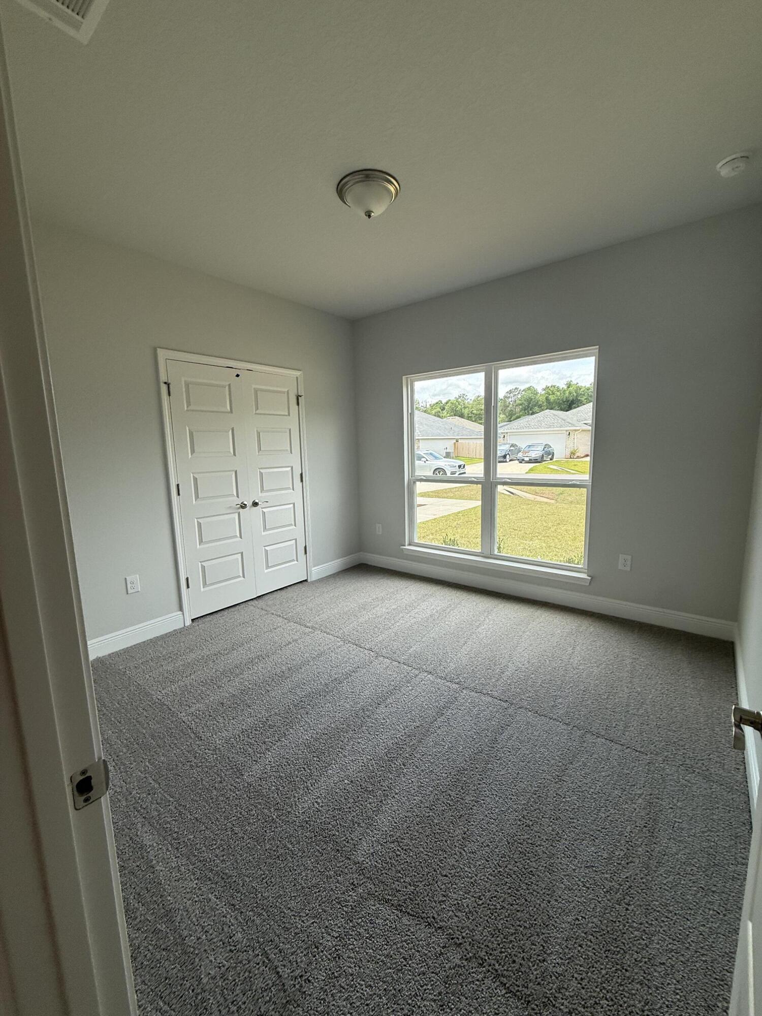 6002 Crocket Cove Crestview, FL 32539 - Photo 7 of 29 a view of an empty room with a window