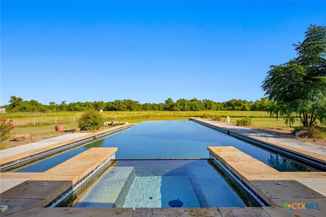 a view of an outside swimming pool