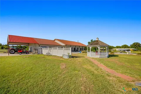 a front view of residential houses with outdoor space and swimming pool