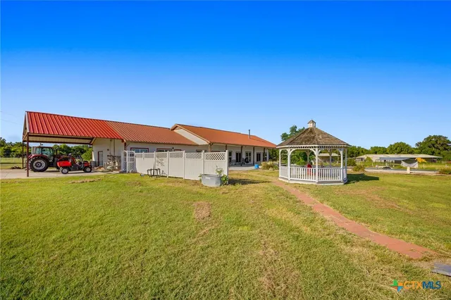a front view of residential houses with outdoor space and swimming pool