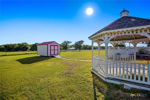 a view of a swimming pool with a deck