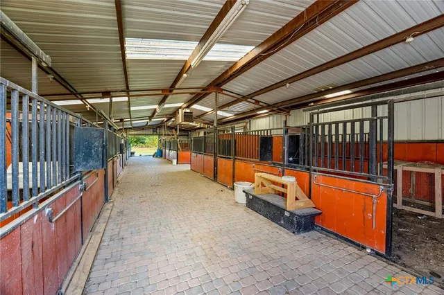 a view of a room with wooden ceiling