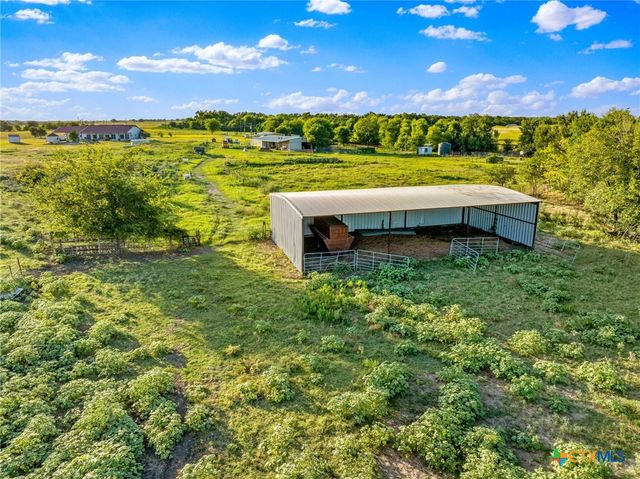 a view of a swimming pool with a yard and lake view