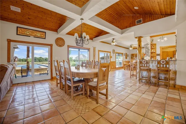 a view of a dining hall with lots of tables and chairs