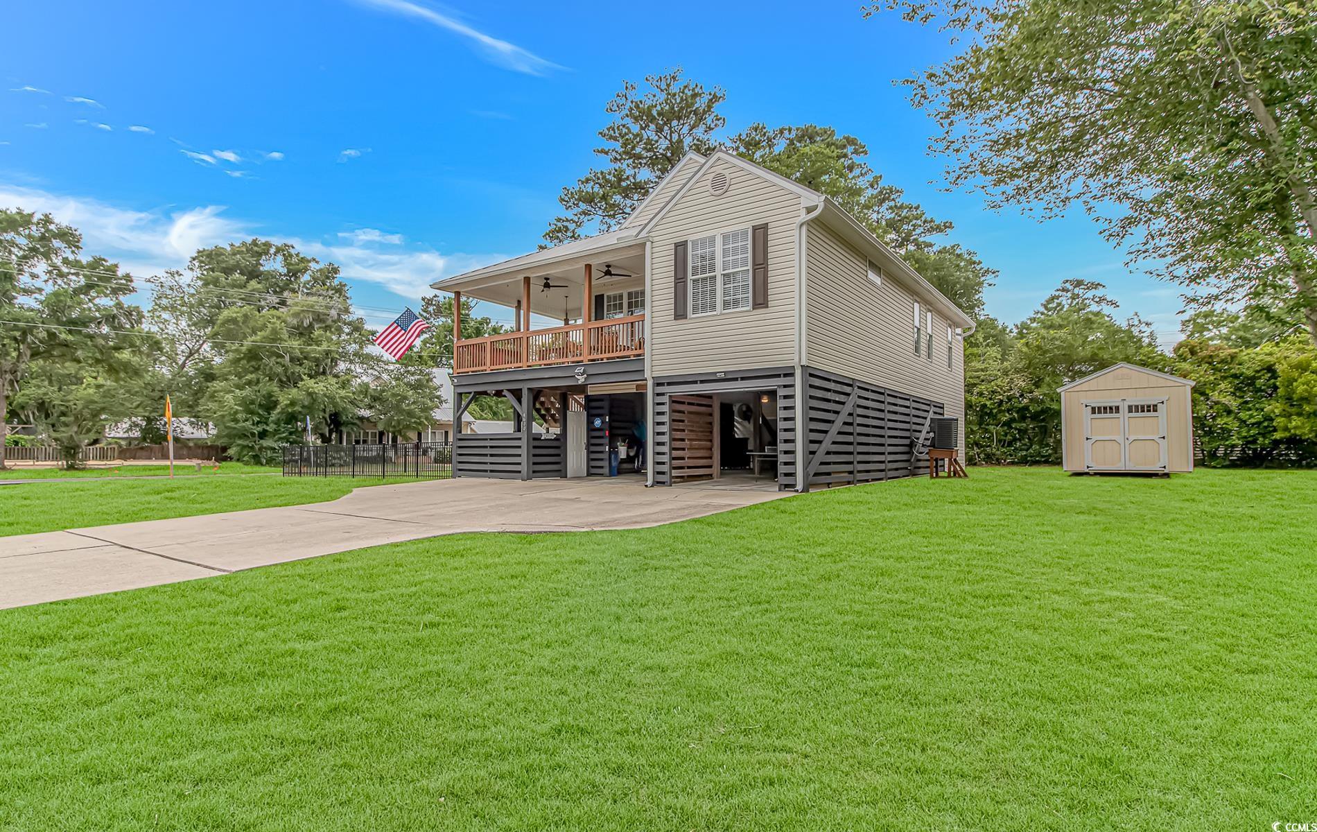 4600 Murrells Inlet Road Murrells Inlet, SC 29576 - Photo 2 of 40 Rear view of property with stairs, a ceiling fan,
