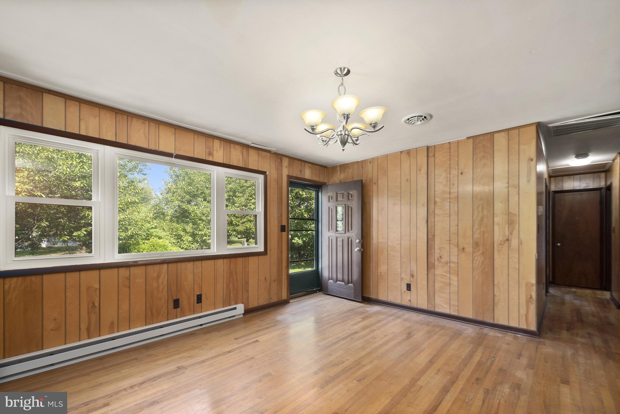 380 Harrisville Road Colora, MD 21917 - Photo 4 of 22 an empty room with wooden floor and windows