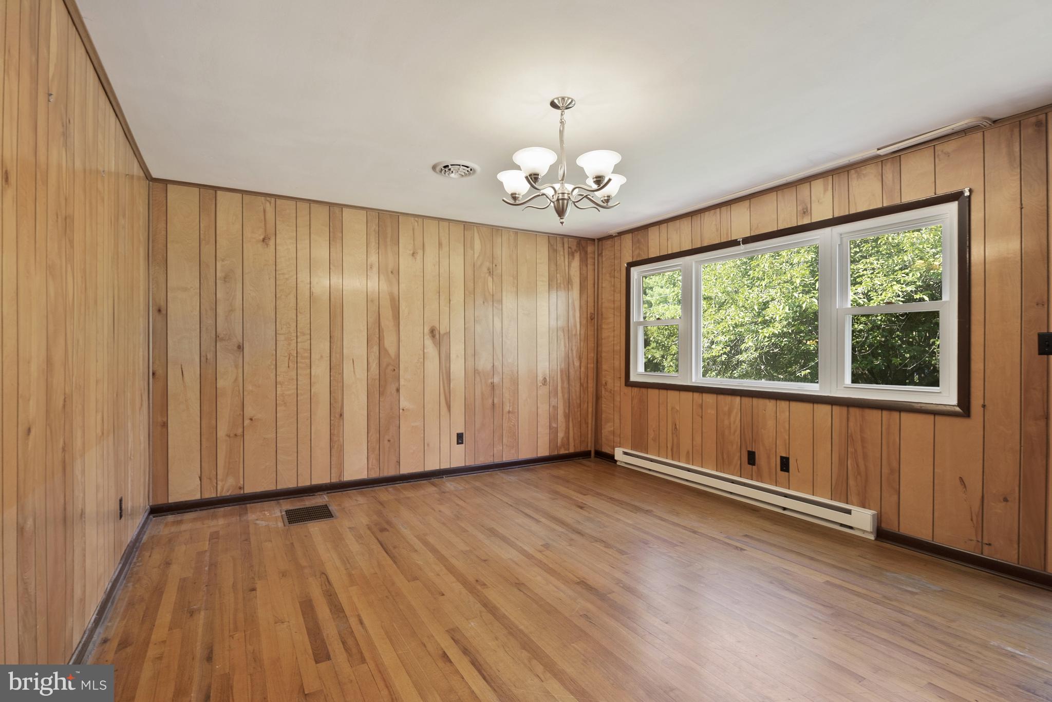 380 Harrisville Road Colora, MD 21917 - Photo 5 of 22 an empty room with wooden floor and windows