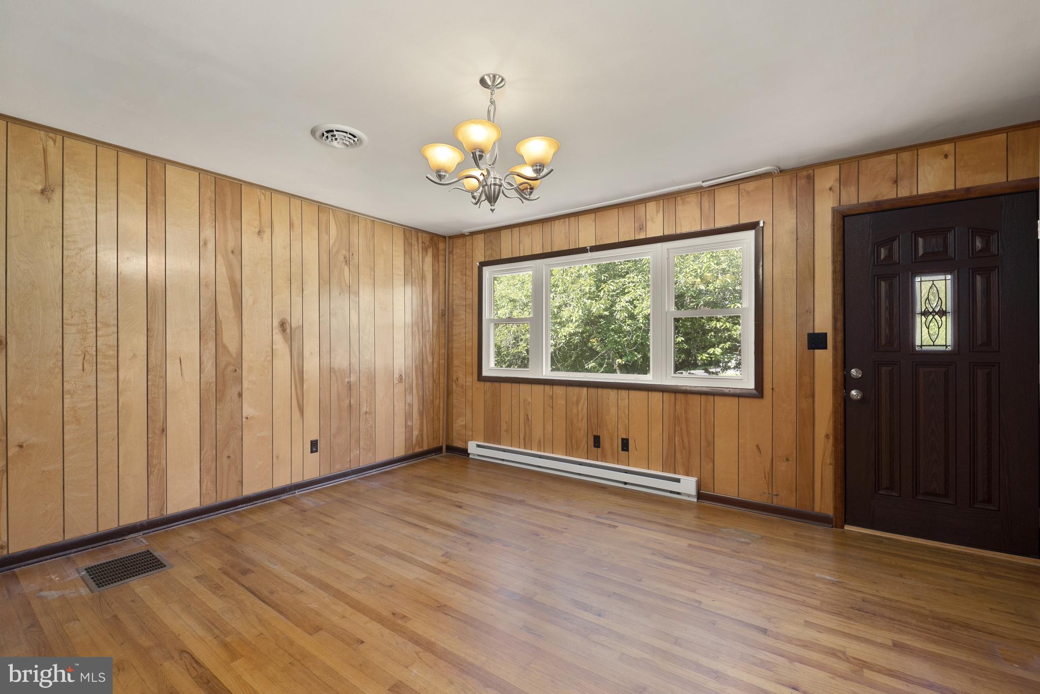 380 Harrisville Road Colora, MD 21917 - Photo 6 of 22 an empty room with wooden floor and windows