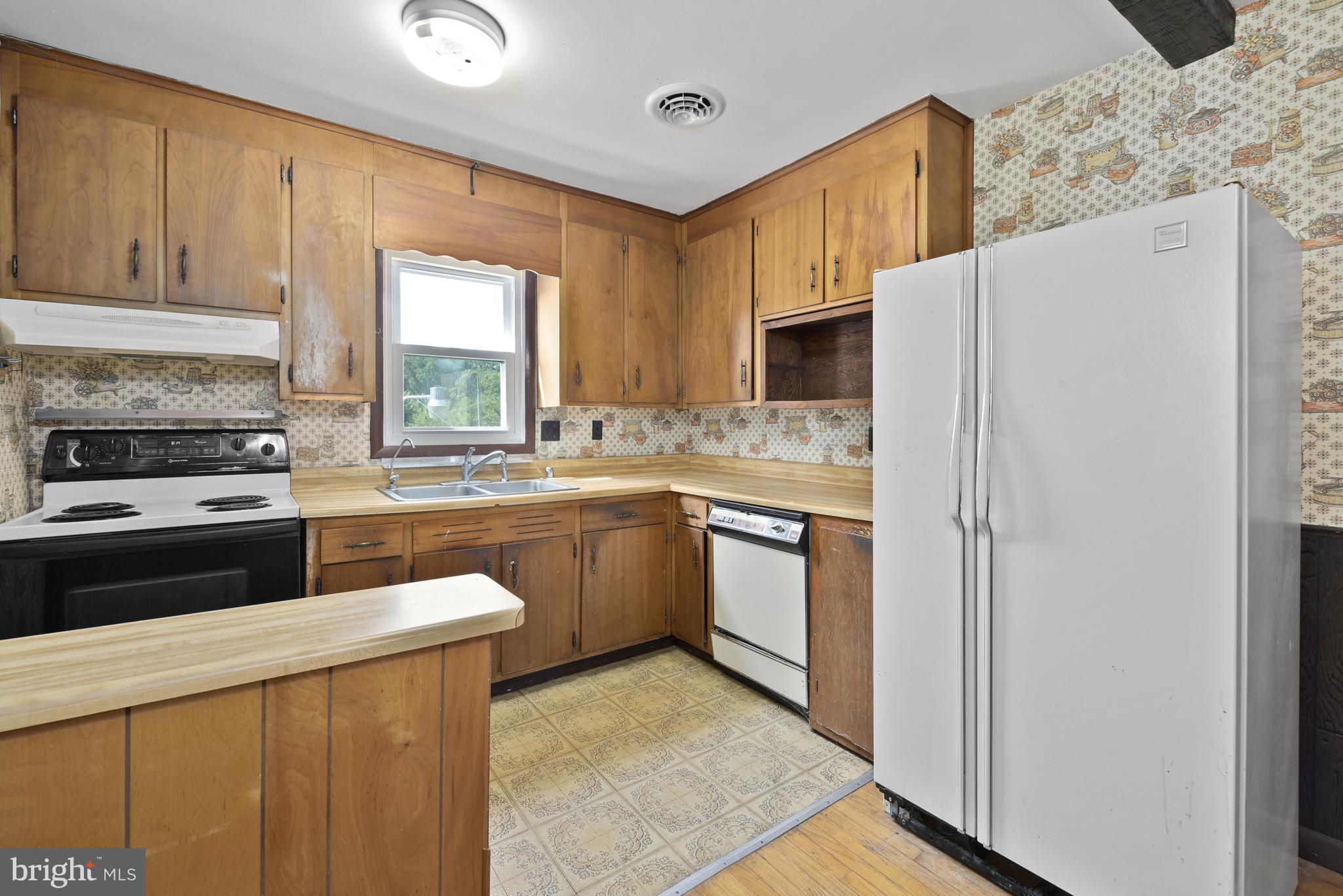 380 Harrisville Road Colora, MD 21917 - Photo 8 of 22 a kitchen with a refrigerator stove and sink