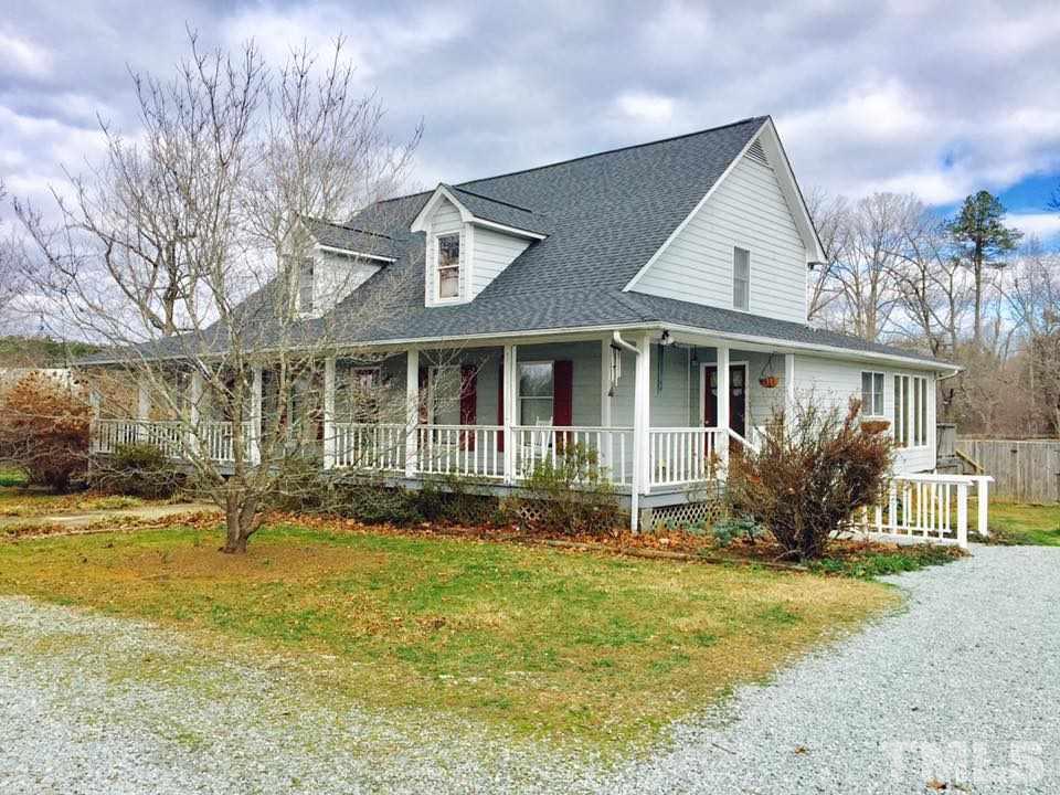 529 Noah Davis Road Roxboro, NC 27574 - Photo 2 of 25 a front view of a house with a garden