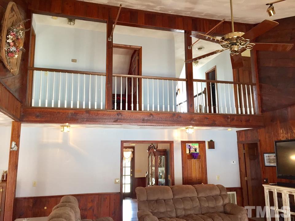529 Noah Davis Road Roxboro, NC 27574 - Photo 12 of 25 a view of a hallway with a dining table and chairs