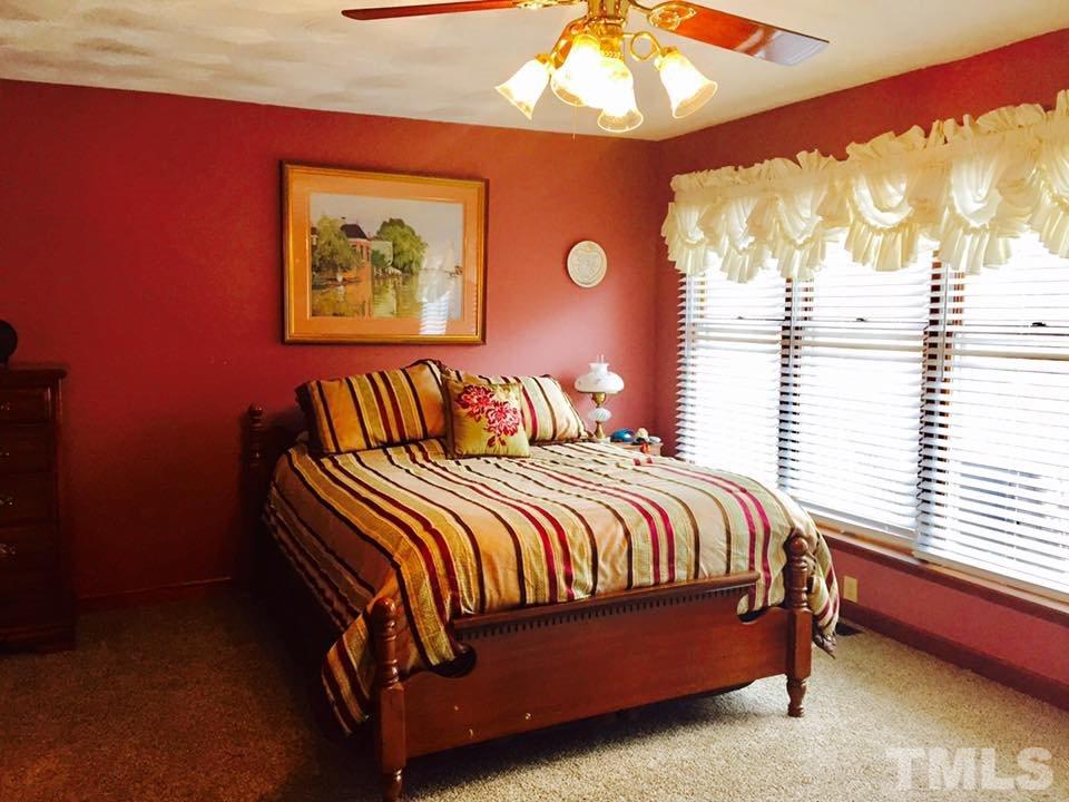 529 Noah Davis Road Roxboro, NC 27574 - Photo 15 of 25 a bedroom with a bed and window