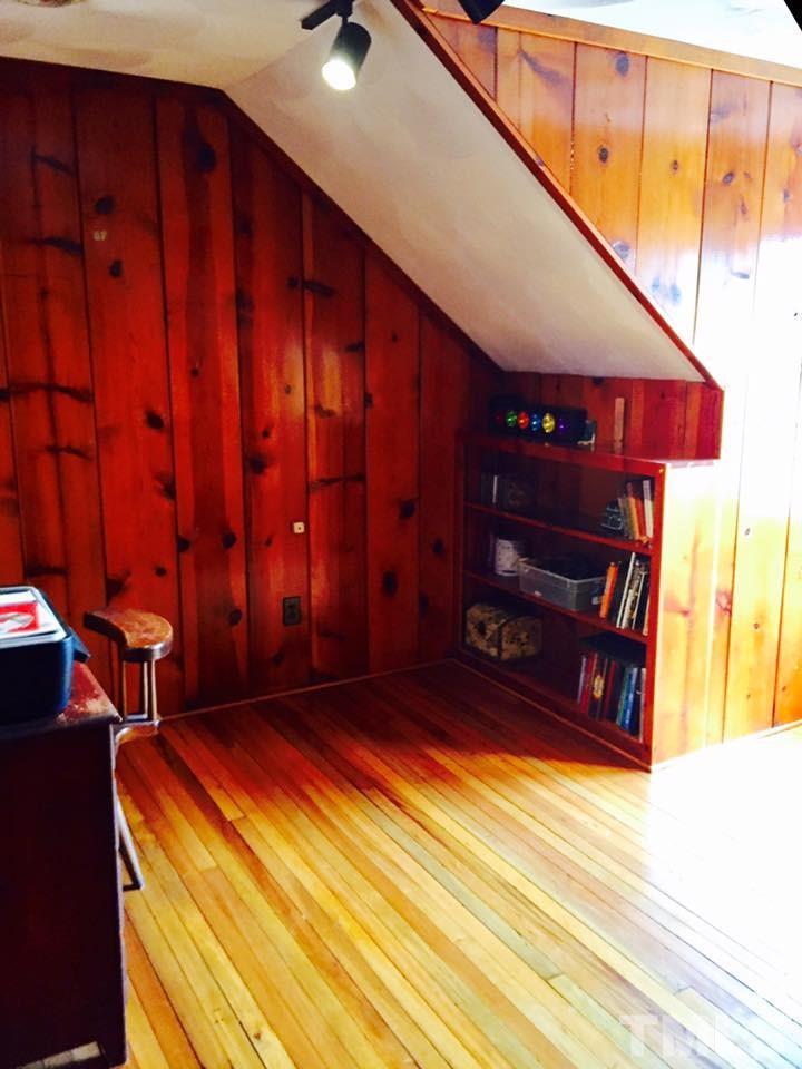 529 Noah Davis Road Roxboro, NC 27574 - Photo 21 of 25 a bedroom with a bed and a dresser