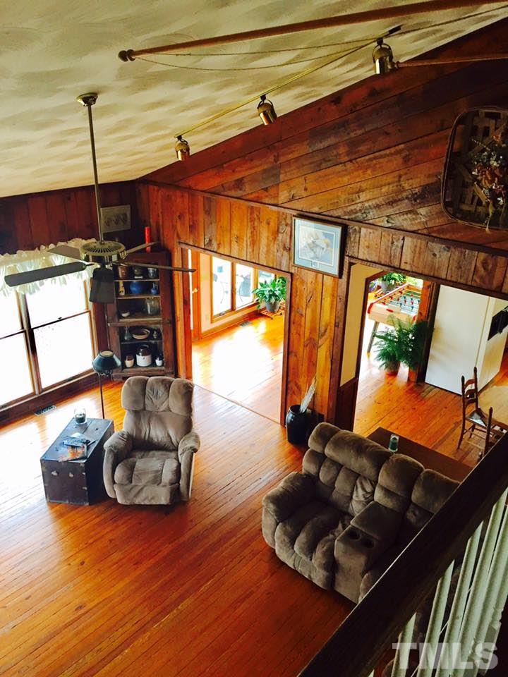 529 Noah Davis Road Roxboro, NC 27574 - Photo 22 of 25 a living room with furniture and a wooden floor