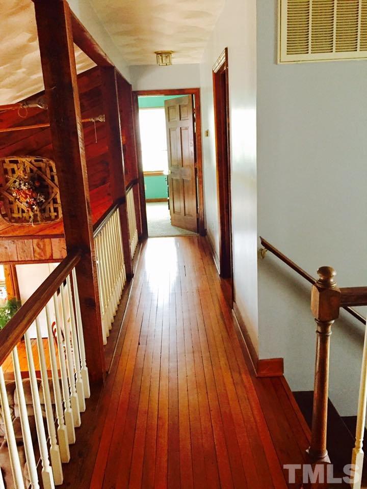 529 Noah Davis Road Roxboro, NC 27574 - Photo 23 of 25 a view of an entryway with wooden floor and door