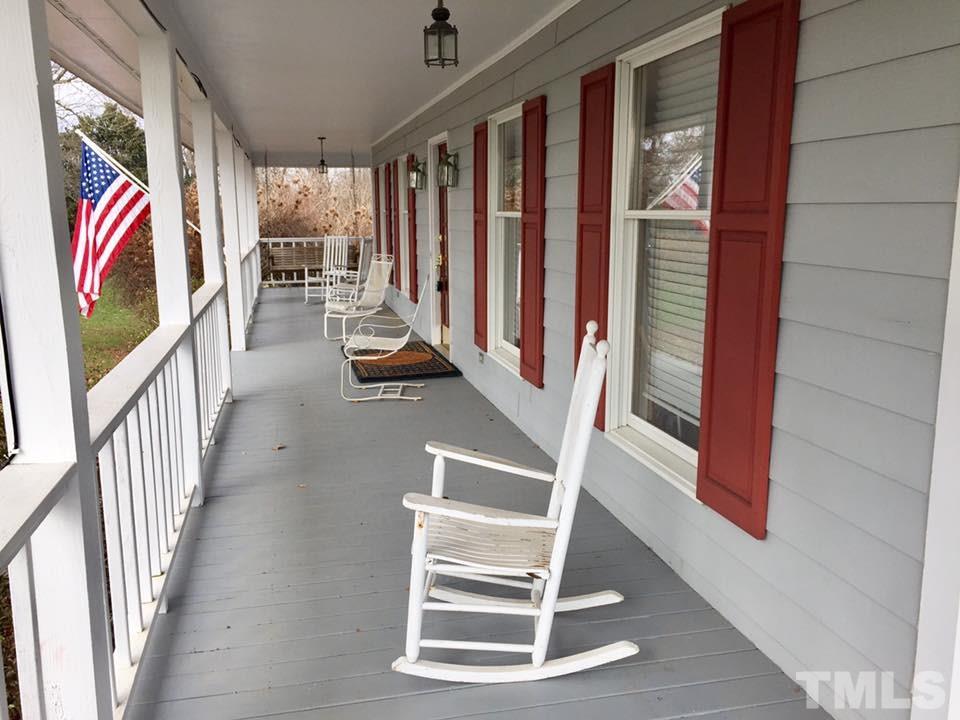 529 Noah Davis Road Roxboro, NC 27574 - Photo 5 of 25 a view of staircase with rug and white walls