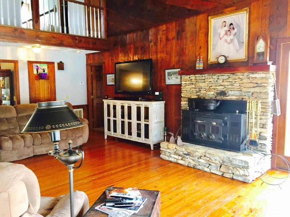 529 Noah Davis Road Roxboro, NC 27574 - Photo 6 of 25 a living room with furniture pool table and a fireplace