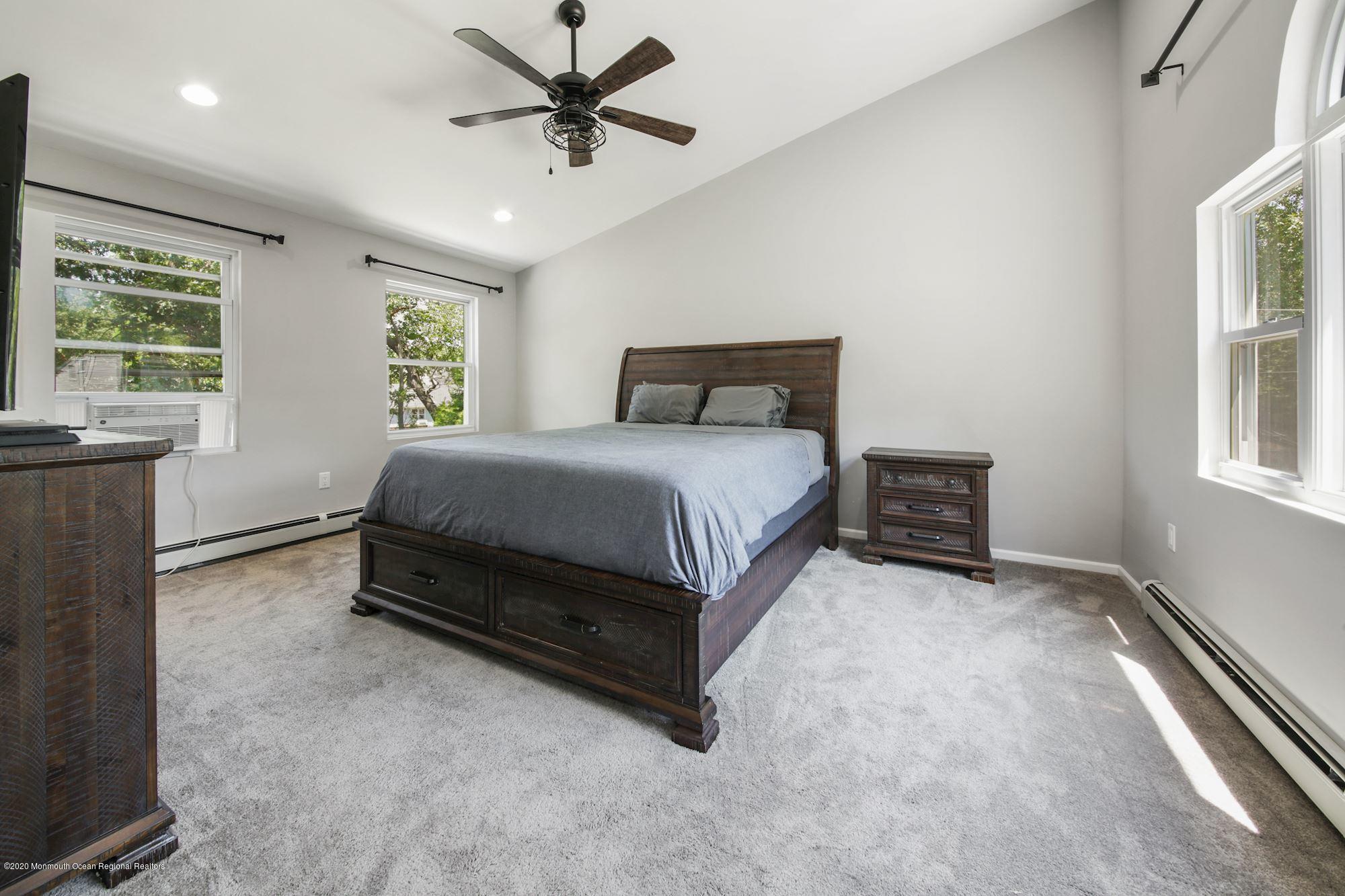 8 Unity Drive Brick, NJ 08723 - Photo 12 of 22 a spacious bedroom with a bed and a window