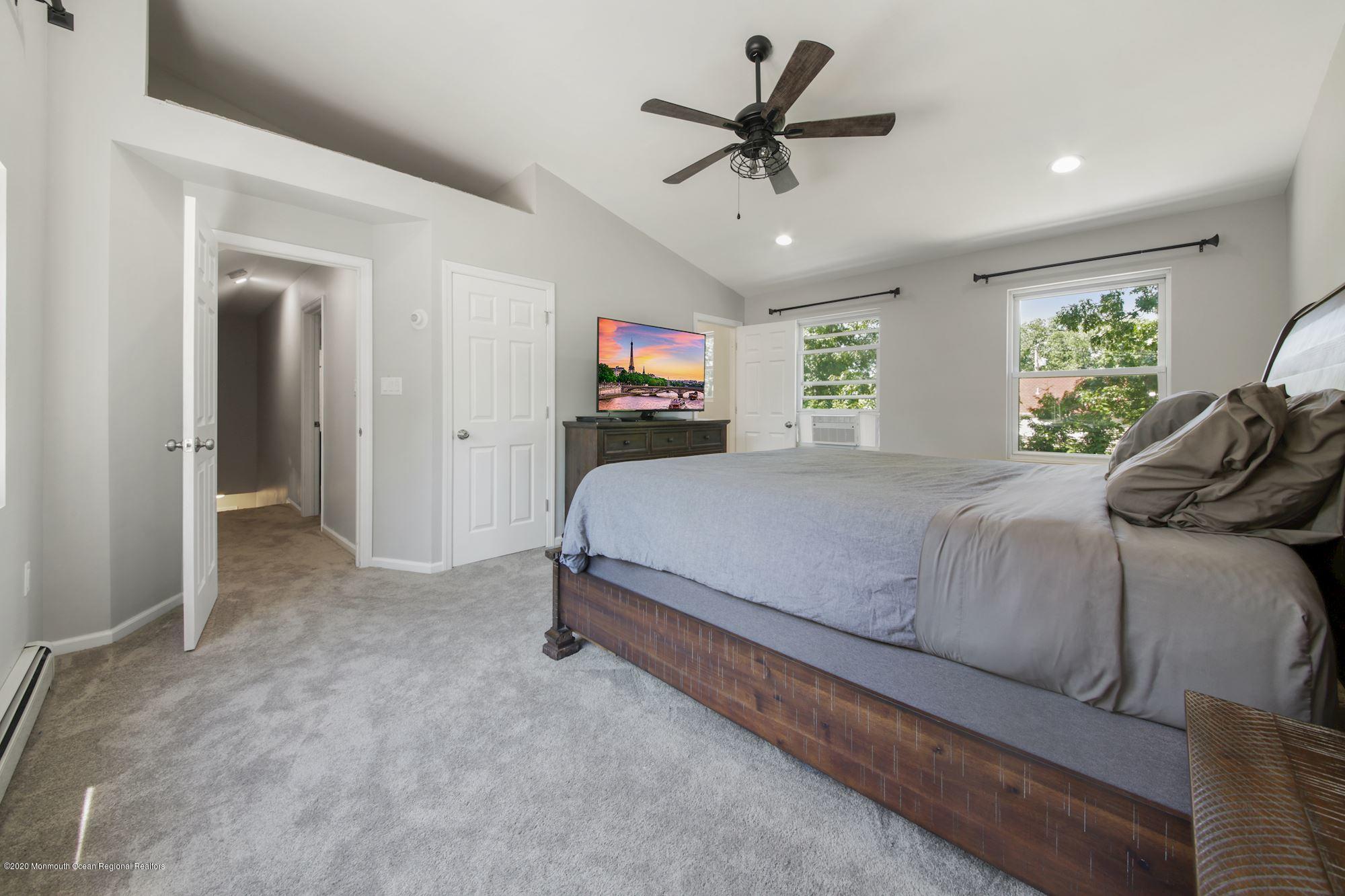 8 Unity Drive Brick, NJ 08723 - Photo 13 of 22 a bedroom with a bed next to a window